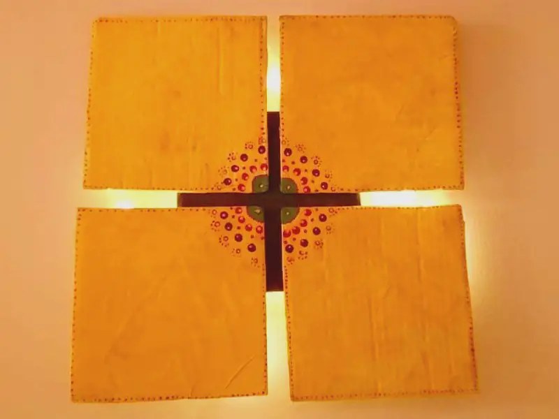 DIY wall art with four yellow squares.